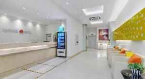 a lobby of a store with couches and a pharmacy at Jinjiang Inn Wenzhou Shuangyu The Terminal in Wenzhou