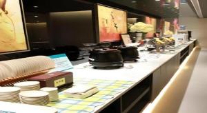 a buffet line with dishes and pots and pans at Jinjiang Inn Tai Zhou Xinghua Yingwu Bridge Branch in Xinghua +58 photos