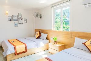 Ένα ή περισσότερα κρεβάτια σε δωμάτιο στο Sea Dragon Hotel Cát Bà & Aparment +57 φωτογραφίες