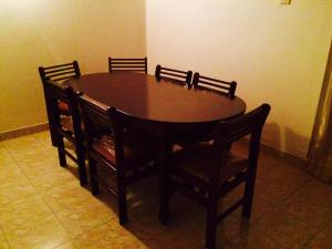 a dining room table with four chairs and a table and a table and chairsktop at Sleep Cheap Home in Negombo