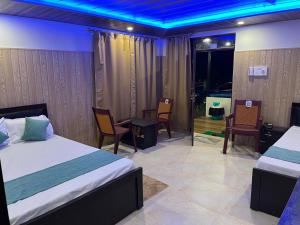 Postel nebo postele na pokoji v ubytování Vedangan Resort Sittong + 7 fotografií