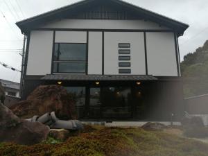 a building with a large window on the side of it at Fujiya in Sango