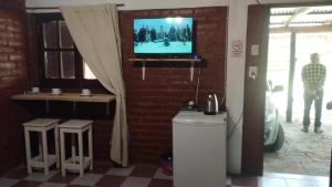 Televisyen dan/atau pusat hiburan di Suite en el corazón de Nono