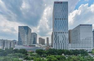 a group of tall buildings in a city at City Comfort Inn Liuzhou Chengzhong Wanda Plaza in Liuzhou