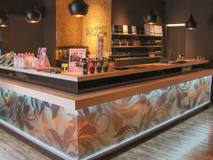 a bar in a restaurant with a counter top at Gran Custama Ueno in Tokyo