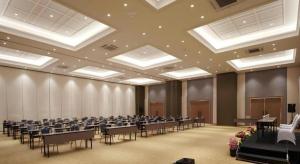 a large room with rows of tables and chairs at Fitra Hotel Majalengka in Majalengka