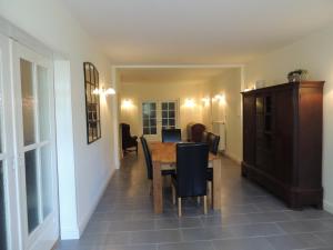 a dining room with a table and chairs at Lindenhof in Grömitz