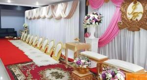 a room with a row of chairs and a table at The Residence Prachinburi in Si Maha Phot