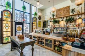 a restaurant with a bar with a table in it at CBD Apartment Pool 24-7 Gym Parking in Cincinnati