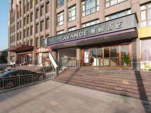 a building with a staircase in front of a building at Lavande Hotels·Anyang Wojin Wanda Plaza in Anyang