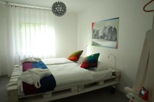 מיטה או מיטות בחדר ב-Avantgarde Living