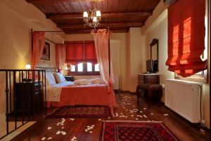 A bed or beds in a room at Menalia Villas & Suites ΚΤΗΜΑ ΚΟΥΜΠΟΥΡΗ