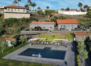 an aerial view of a house with a swimming pool at Locale Dimora Rurale in Adrano
