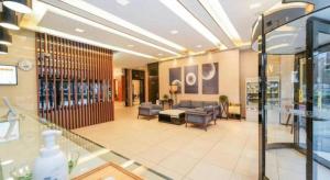 a lobby of a store with a couch and chairs at Jinjiang Inn Select Shanghai International Tourism and Resorts Zone Chuansha Road Subway Station in Shanghai