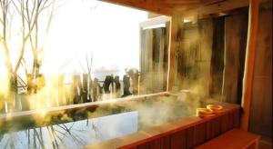 a room with a window with a view of a city at Auberge Kitano Dandan in Abashiri +180 photos