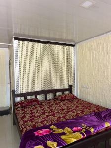 Postel nebo postele na pokoji v ubytování South point homestay