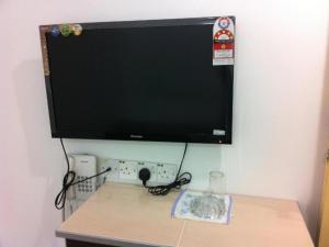 a computer monitor on top of a desk at Chin Yee Hotel in Teluk Intan