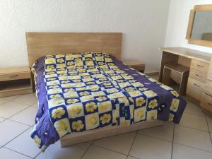 Postelja oz. postelje v sobi nastanitve Apartment Tamarinier Complexe
