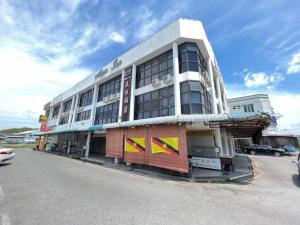 a building on the side of a street at Mega Inn Sri Aman in Simanggang