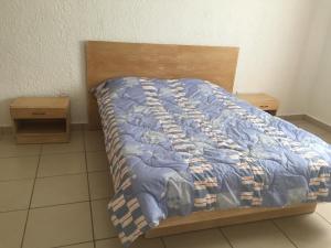 Postelja oz. postelje v sobi nastanitve Apartment Tamarinier Complexe
