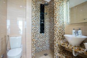 a bathroom with a toilet and a sink at Apartment SuperSeaView in Sutomore +54 photos