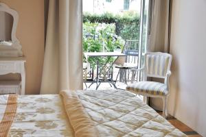 Postel nebo postele na pokoji v ubytování Lucca Relais