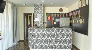a room with a table with a table cloth on it at Hotel CheckedInn in Ipoh
