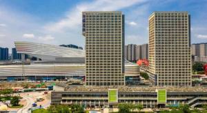 a group of tall buildings in a city at Imin Hotel in Huadu