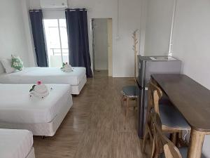 Un pat sau paturi într-o cameră la Comfy Hotels Suvarnabhumi Airport