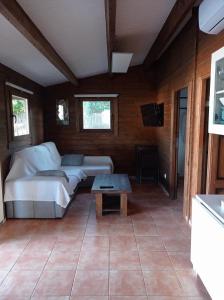 a living room with a couch and a table at El Vivero in Chiclana de la Frontera