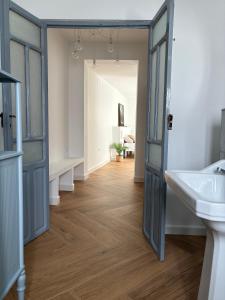a bathroom with a white sink and a mirror at Casa Manuel in Mogón +30 photos