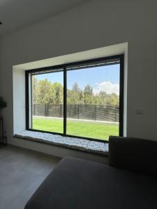 a room with a large window with a view of a field at וילה יובל in Yuval