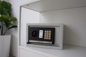 a microwave oven sitting on top of a shelf at A&J Holiday Villa in Ban Na Bon