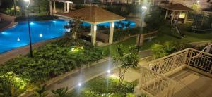 an overhead view of a swimming pool at night at The Luxe at The Pent in Manila