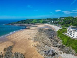 an aerial view of a beach with a building at Coastal Escape by the Beach in The Mumbles