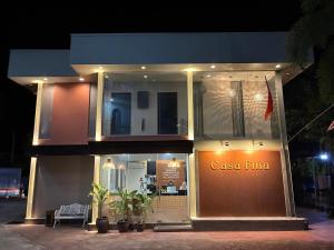a casa flilla store front at night at Casa Fina Fine Homes in Pantai Cenang