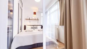 Ένα ή περισσότερα κρεβάτια σε δωμάτιο στο Sunshine City Apartment - Leipzig Zentrum - Kostenfreier Tiefgaragenstellplatz