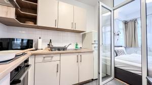 Η κουζίνα ή μικρή κουζίνα στο Sunshine City Apartment - Leipzig Zentrum - Kostenfreier Tiefgaragenstellplatz