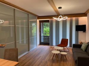 Χώρος καθιστικού στο Gut ausgestattete Ferienwohnung in der Nähe des Millstätter Sees