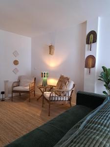 a bedroom with a bed and a table and chairs at Casa do Logradouro in Alcochete +42 photos