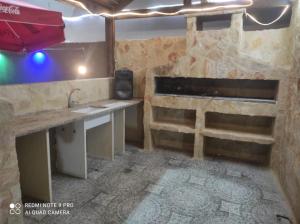a room with a bed and a desk in a room at Chalet Wayne in Amman