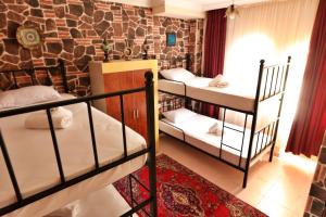 Postel nebo postele na pokoji v ubytování Cappadocia Hostel