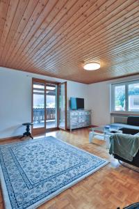 a living room with a large rug on the floor at Wohlfühlwohnung nahe Basel und der Natur des Jura in Liesberg
