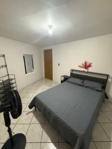 a bedroom with a bed and a tripod in it at Casa en segunda planta in Hidalgo del Parral