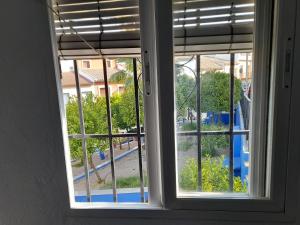 an open window with a view of a playground at A beautiful Townhouse in Rute