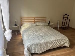 a bedroom with a bed and two side tables at Residence DELLE GRIGNE in Cusano Milanino