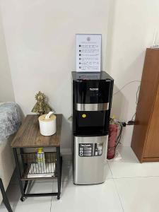 a coffeemaker sitting on top of a coffee maker at JLC Crib in Naga