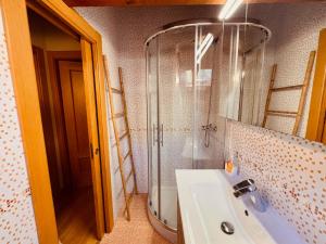 a bathroom with a shower and a sink and a mirror at Apartamento Acogedor con Vistas Espectaculares en Liébana, Picos de Europa in Camaleño +37 photos