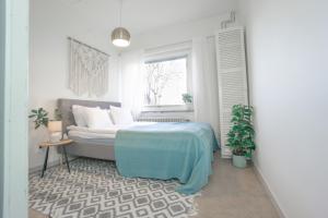 a bedroom with a bed and a window at Haha light in Gothenburg