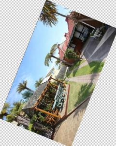a picture of a house with palm trees on it at Pure Motel in Rotorua